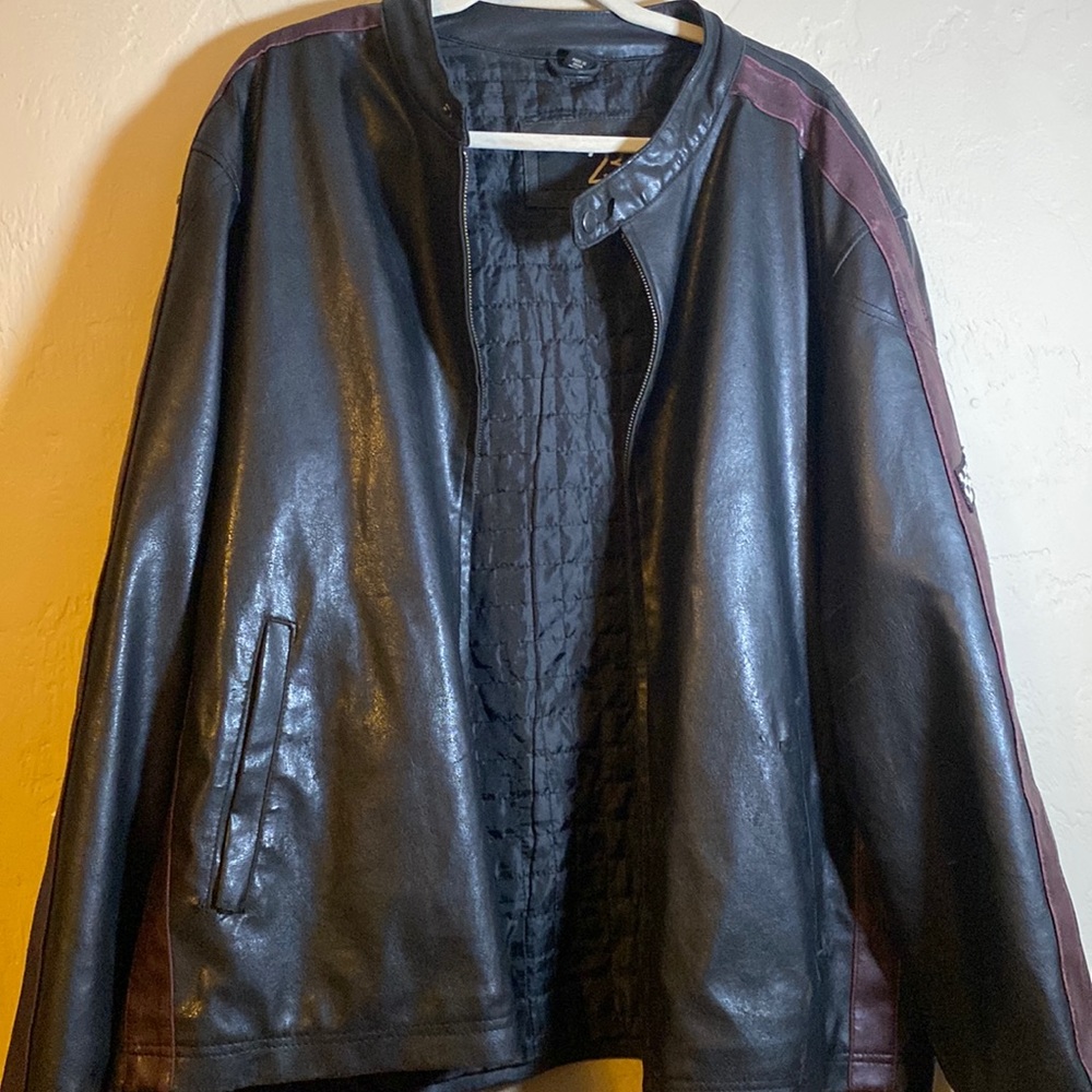 Black leather jacket with maroon stripes on the side with checkered flag badge